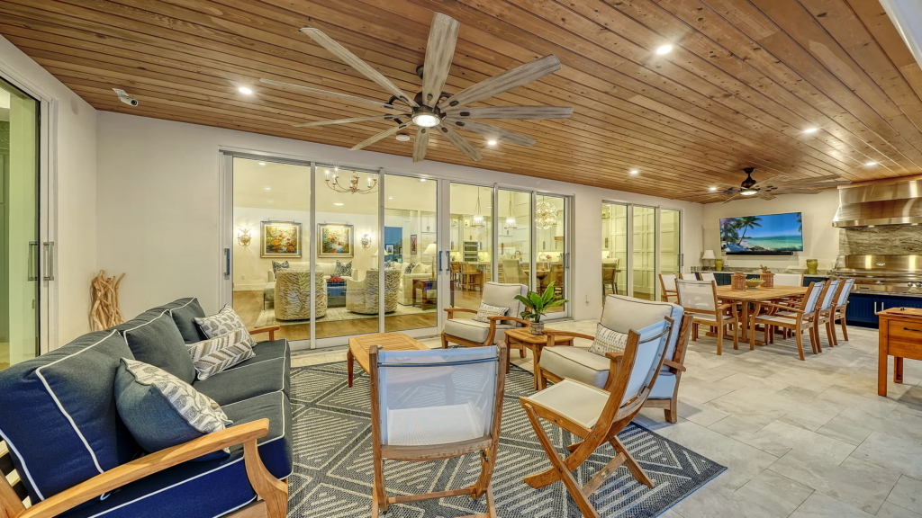 Covered lanai with wood ceiling and outdoor living area