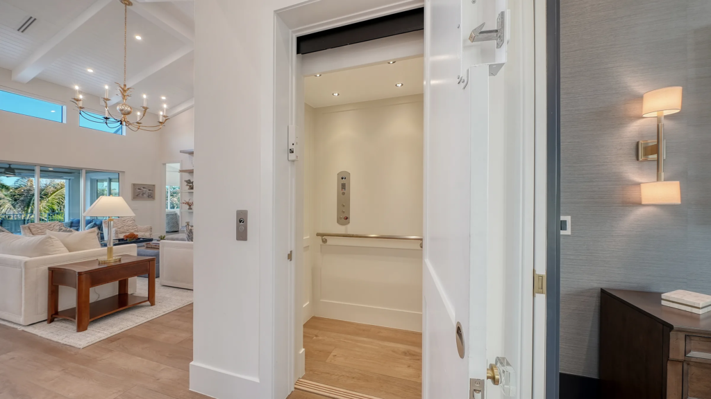 Residential elevator off the foyer of a custom home